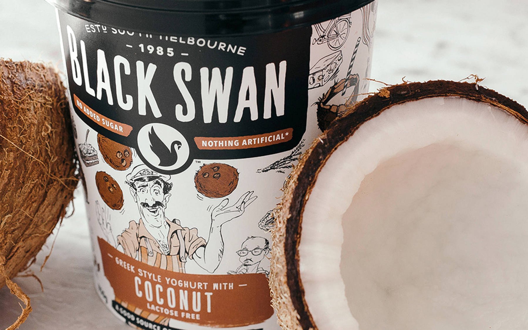 Close up of Black Swan's Low Fat Greek Style Yoghurt coconut packaging.