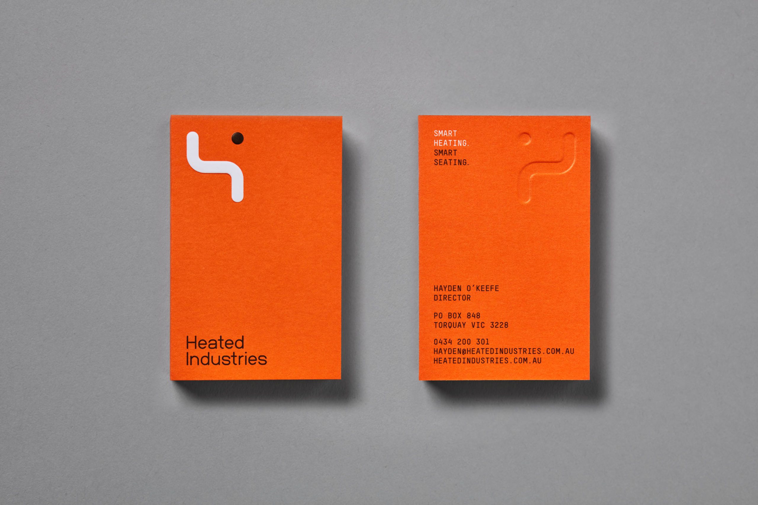 Heated Industries business card showcasing both front and back sides.