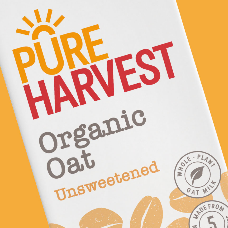 Close up of Pure Harvest Organic oat milk packaging