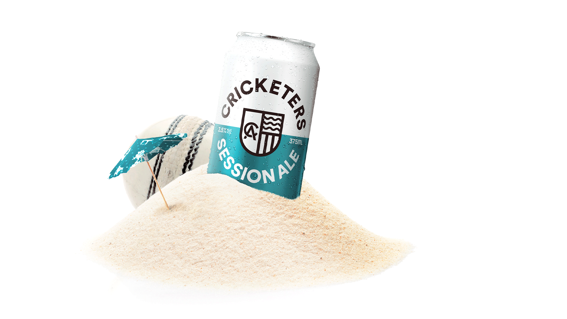 Cricketers Session Ale can in a sand pile, next to a cricket call and cocktail umbrella.