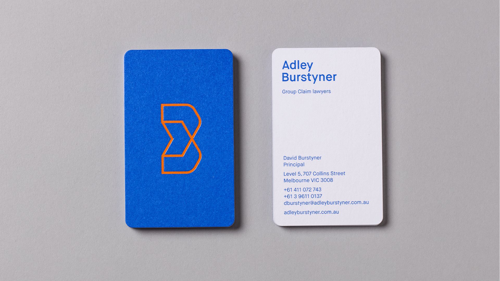 Adley Burstyner Law Firm branding business card front and back sides presented