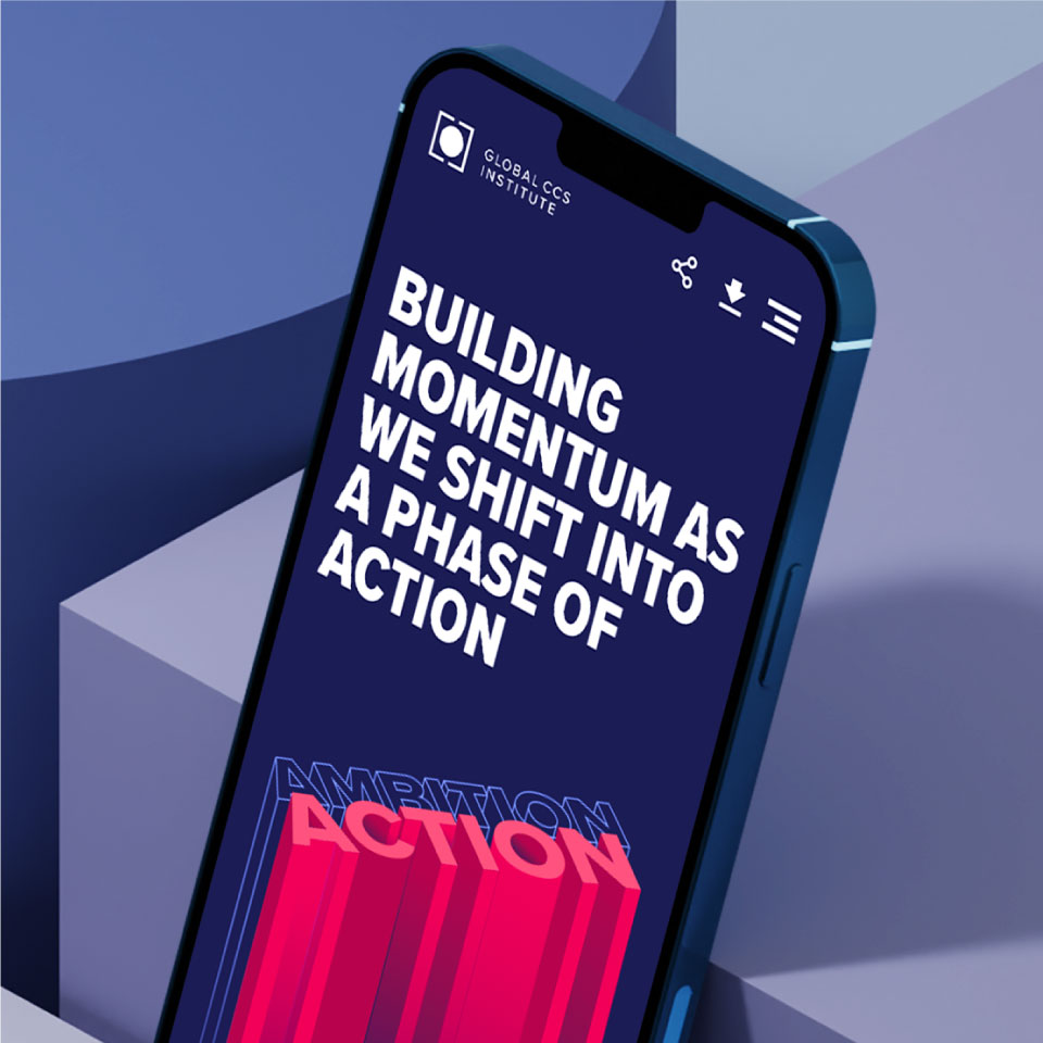 iphone with Global Carbon Capture Campaign Homepage on its screen. Stating that 'Building momentum as we shift into a phase of action'.