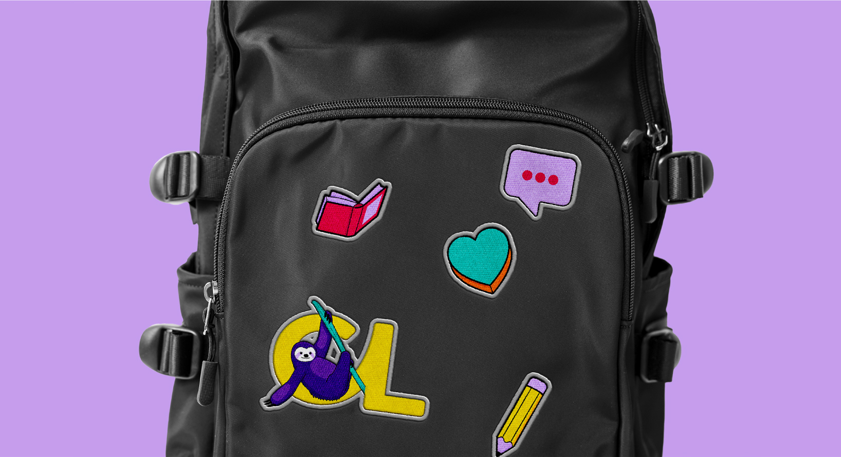 CCL badges on a black backpack, sitting on a purple background